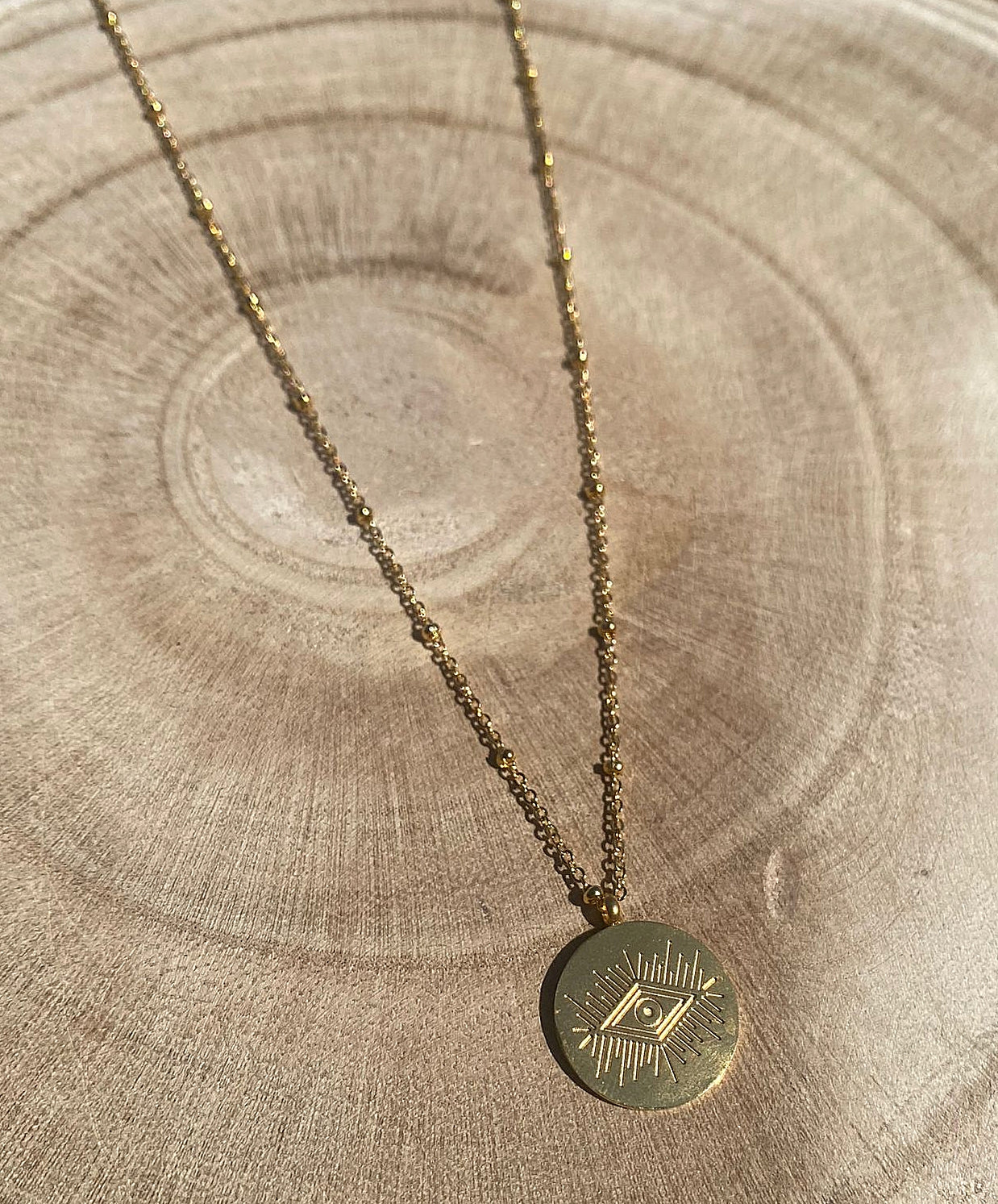 Collier gold eye